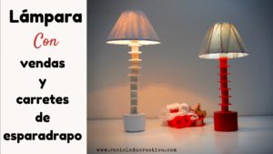 Lámpara con vendas y carretes de esparadrapo y botes de crema reciclados