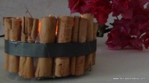 Portavelas con ramitas de canela, reciclando latas de atún